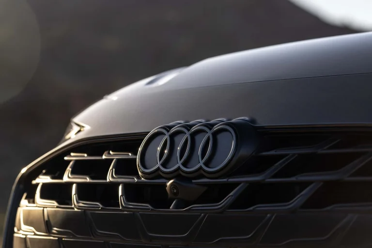 The interior design of a modern Audi vehicle focusing on the dashboard and center console