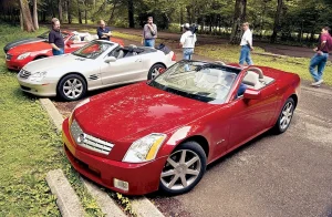 2004 luxury convertible lineup featuring Cadillac roadster