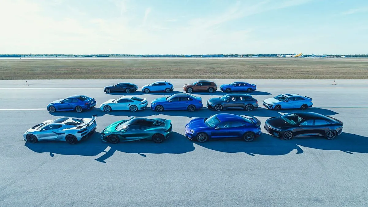 A collection of high-performance vehicles participating in a speed and braking test at Oscoda-Wurtsmith Airport.