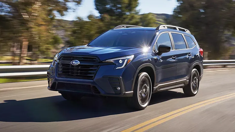 A comparison overview of various three-row SUV models on the road.