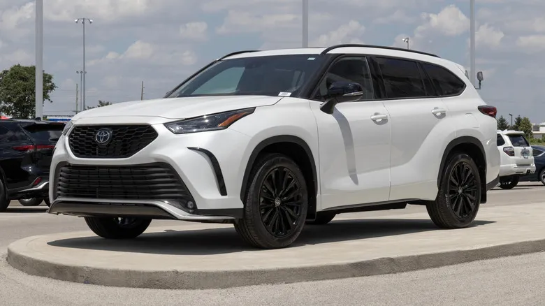 A line of mid-size and compact SUVs parked outdoors for comparison