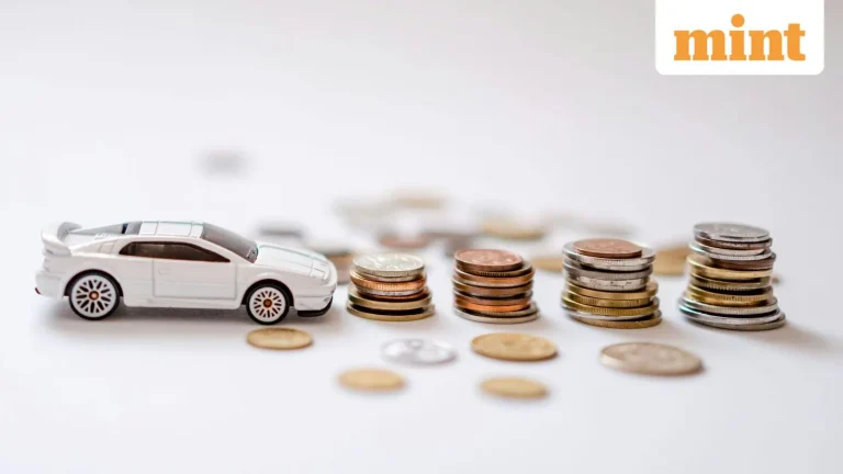 A professional driver holding car keys next to a corporate lease vehicle