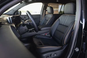 Inside cabin of the 2027 Chevy Traverse High Country showing the Jet Black and Natural Tan color scheme.