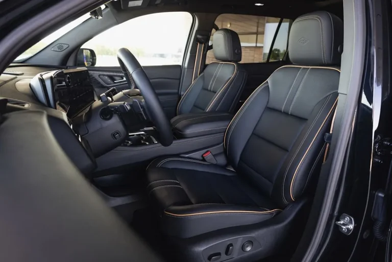 Inside cabin of the 2027 Chevy Traverse High Country showing the Jet Black and Natural Tan color scheme.