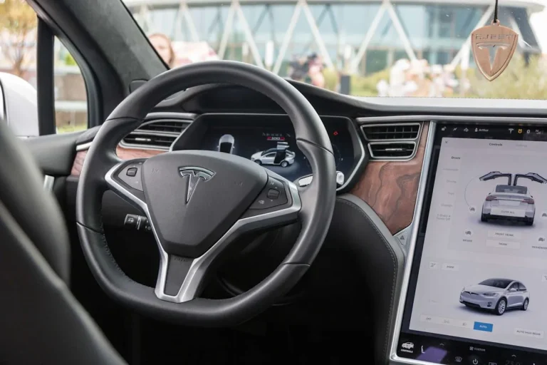 Modern connected electric vehicle dashboard showing digital software interface