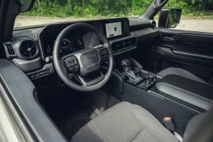 The retro-inspired dashboard and physical controls of the 2026 Toyota Land Cruiser 1958 interior