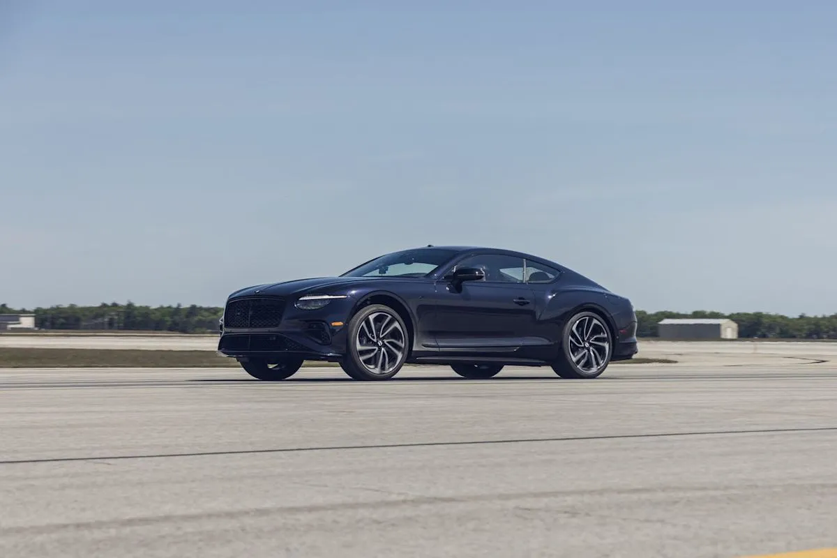 A luxury Bentley Continental GT S performing a high-speed acceleration and braking test.