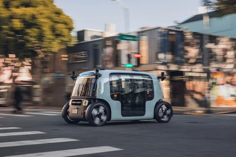 An operator monitoring autonomous vehicles from a remote workstation computer screen