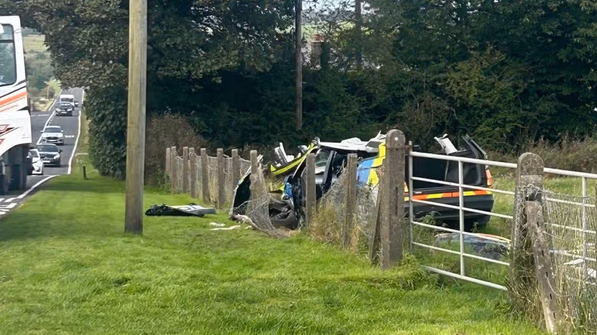 Emergency services responding to a severe road traffic collision involving a police vehicle