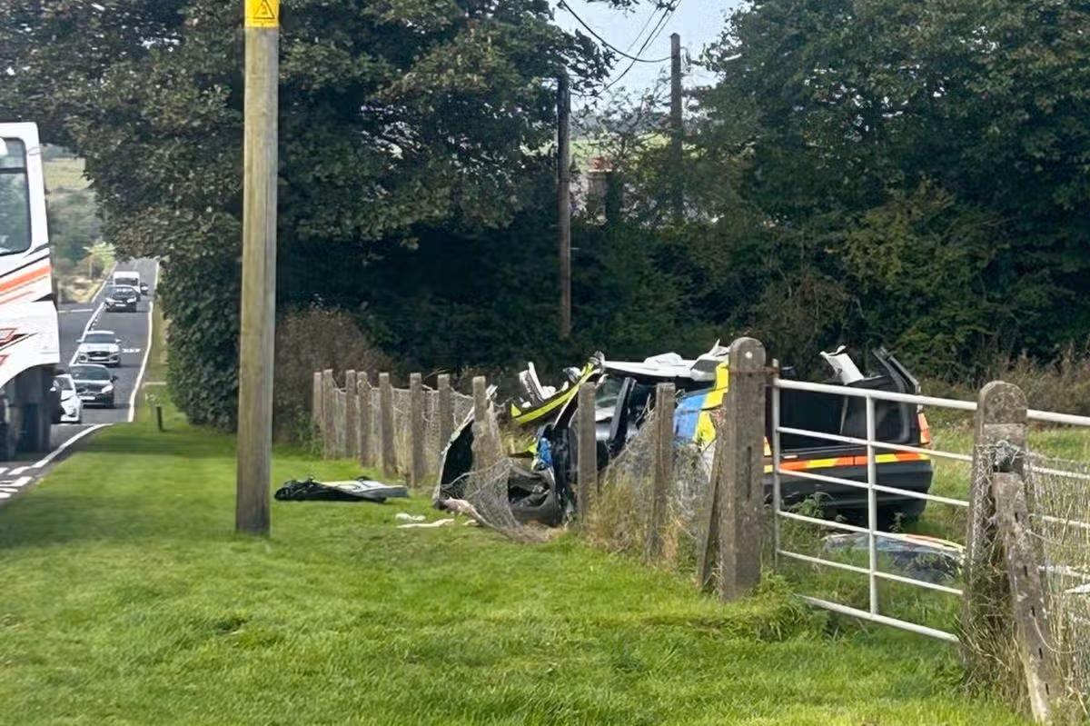Emergency services responding to a severe road traffic collision involving a police vehicle