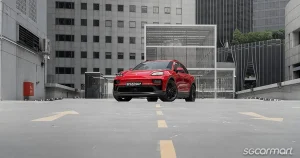 The front profile of the all-electric Porsche Macan GTS highlighting its sporty design