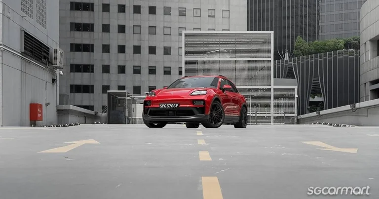 The front profile of the all-electric Porsche Macan GTS highlighting its sporty design