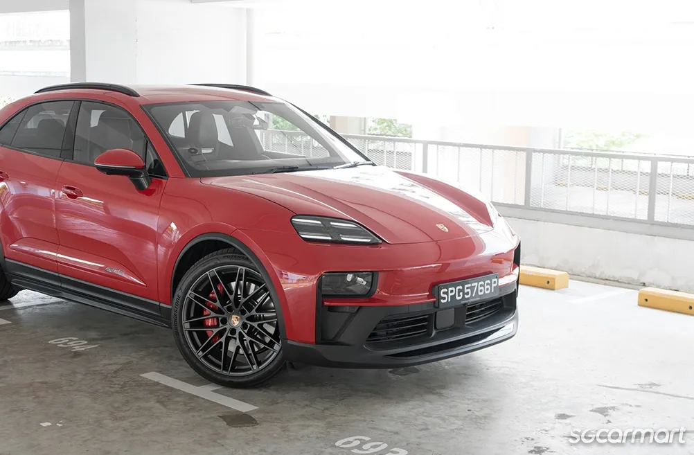 The front profile of the all-electric Porsche Macan GTS highlighting its sporty design